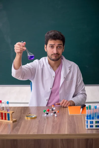 Young Chemistry Teacher Sitting Classroom —  Fotos de Stock