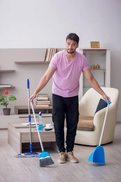 stock image Young contractor cleaning the house