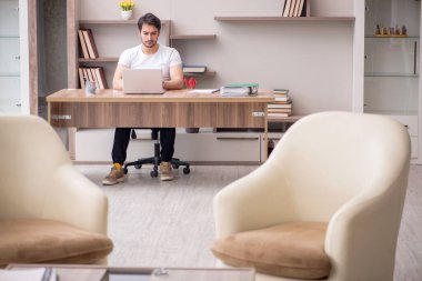 Young employee working from home during pandemic