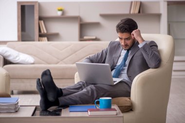 Young employee working from home during pandemic