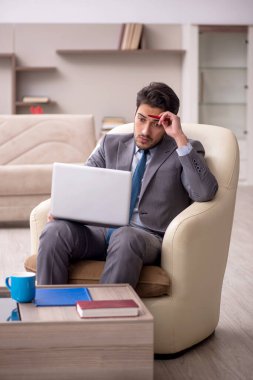 Young employee working from home during pandemic