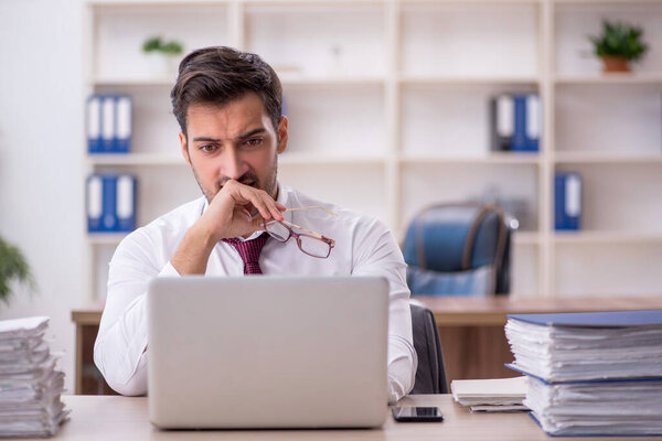 Young businessman employee sitting at workplace