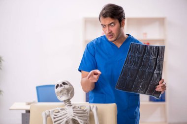 Young doctor and skeleton patient at the hospital