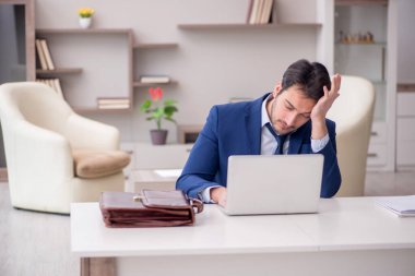 Young employee working from home during pandemic