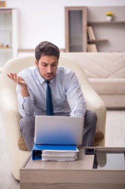 Young employee working from home during pandemic