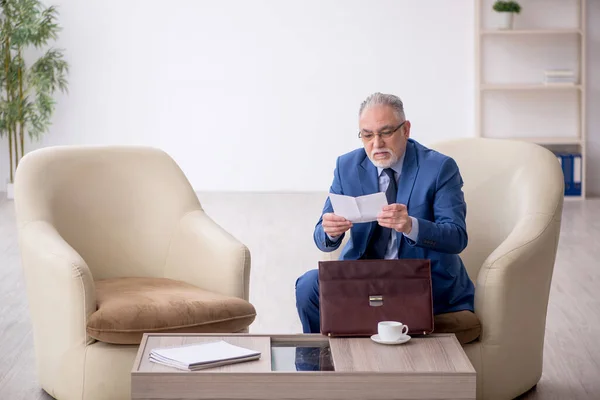 stock image Old male boss waiting for business meeting