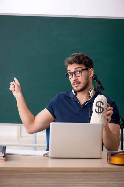 Young Music Teacher Holding Moneybag Classroom — Stock Photo, Image