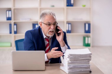 Old employee unhappy with excessive work at workplace
