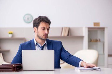 Young employee working from home during pandemic