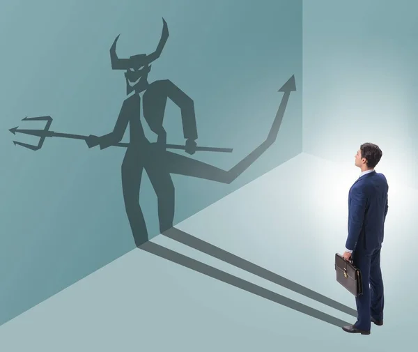 stock image The devil hiding in the businessman - alter ego concept