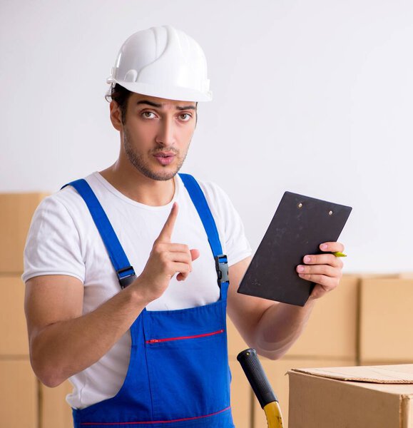 The young male professional mover doing home relocation
