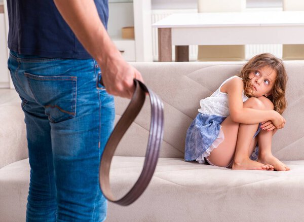 The angry father punishing his daughter