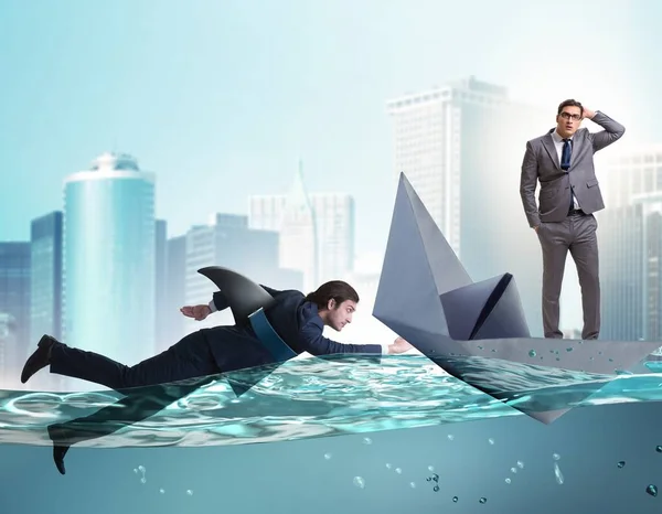 The businessmen in competition concept with shark