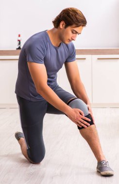 The man exercising for knee injury recovery
