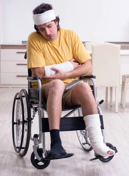 Stock image The young man after accident recovering at home