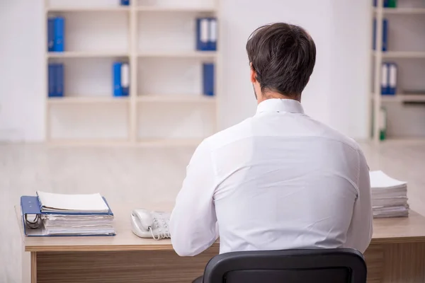 stock image Young businessman employee sitting at workplace