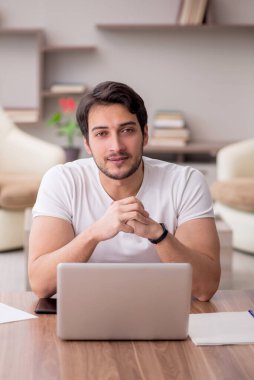 Young employee working from home during pandemic