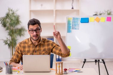 Young designer working at workplace