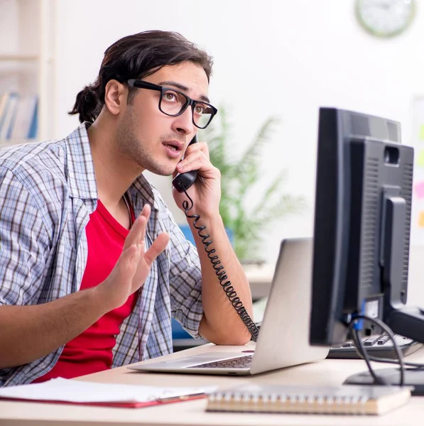 stock image The male it specialist working in the office