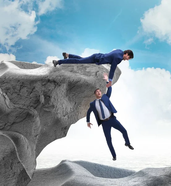 Businessman Offering Helping Hand Falling Colleague — Stock Photo, Image