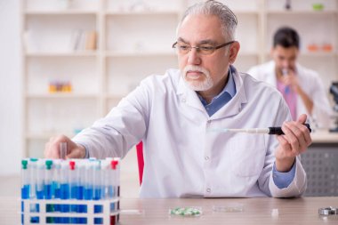 Two chemists working at the lab
