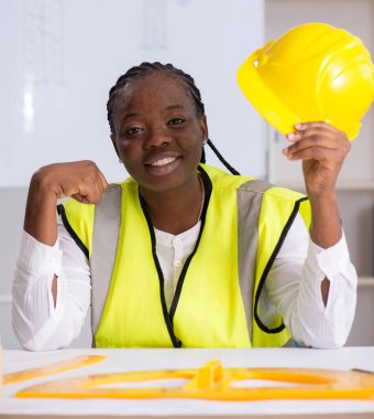 The young black architect working on project