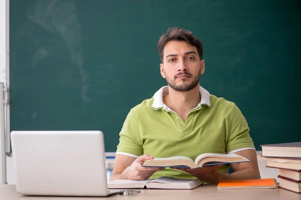 Young Student Sitting Front Green Board — Stock Photo, Image