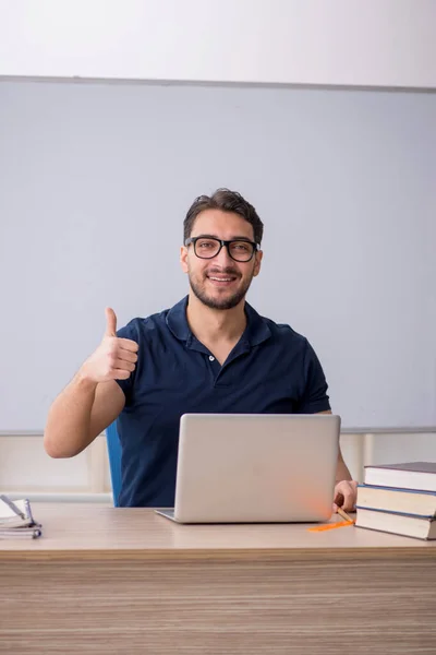 stock image Young teacher in telestudying concept