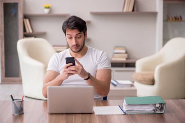 Young employee working from home during pandemic