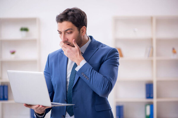 Young employee working at workplace