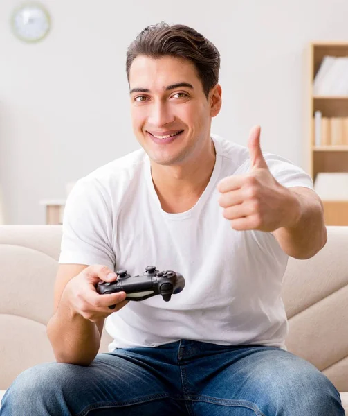 stock image The man addicted to computer games
