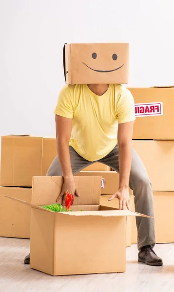 The happy man with box instead of his head