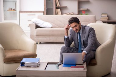 Young employee working from home during pandemic