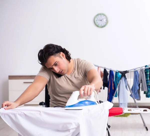 Young Man Wheel Chair Doing Ironing Home — Stock Photo, Image