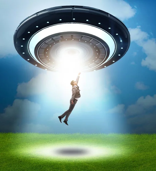 Flying Saucer Abducting Young Businessman — Stock Photo, Image