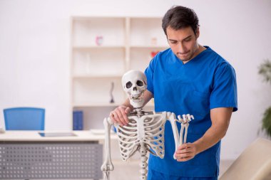 Young doctor and skeleton patient at the hospital
