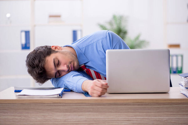Young employee working in the office