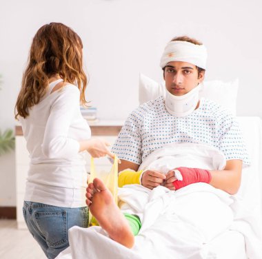 The loving wife looking after injured husband