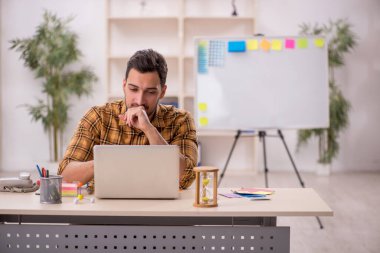 Young designer working at workplace