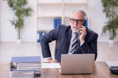 Old boss employee and too much work at workplace