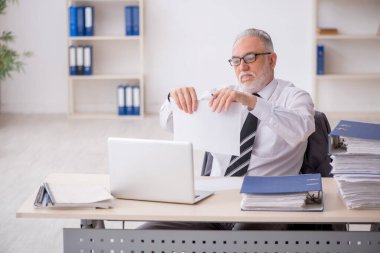 Old employee unhappy with excessive work at workplace