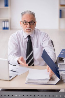 Old employee unhappy with excessive work at workplace