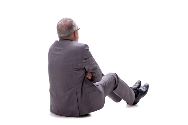 Yaşlı Işadamı Beyaz Zeminde Tek Başına Oturuyor — Stok fotoğraf
