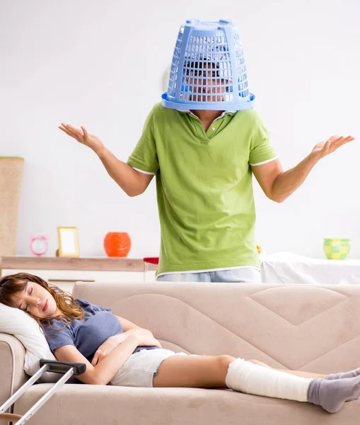 Husband Helping Leg Injured Wife Housework — Stock Photo, Image