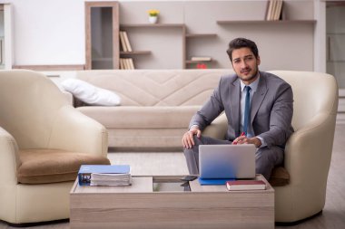 Young employee working from home during pandemic