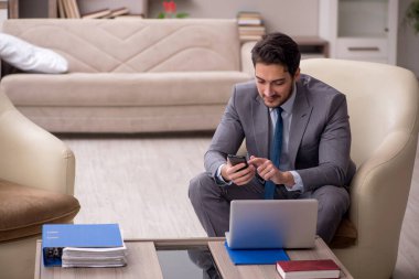 Young employee working from home during pandemic