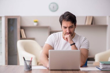 Young employee working from home during pandemic