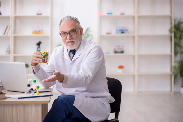 Old Doctor Holding Molecular Model — Stock Photo, Image