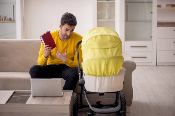 stock image Young contractor looking after baby at home