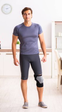 The man exercising for knee injury recovery